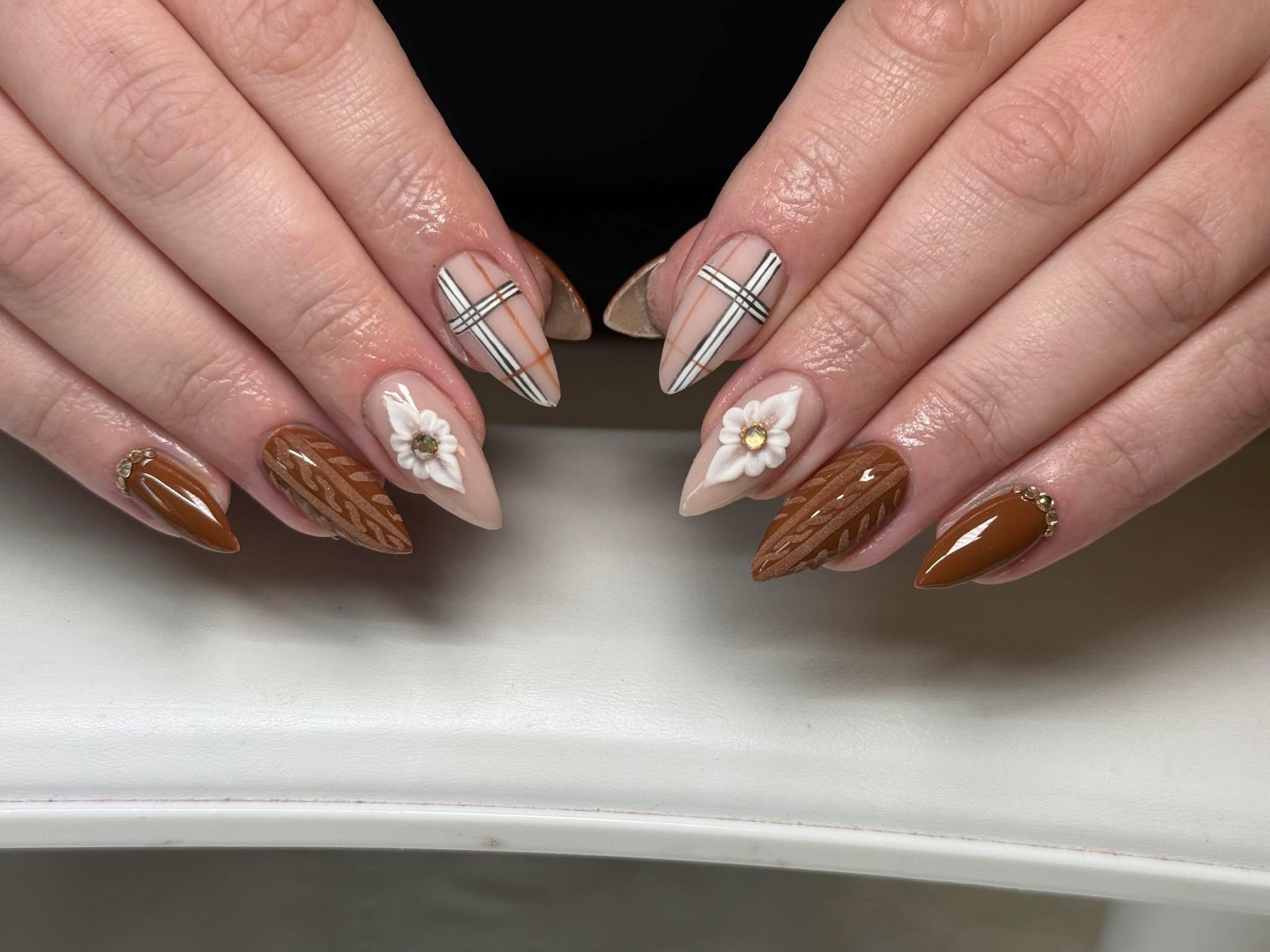 Brown textured nails with hand-painted details